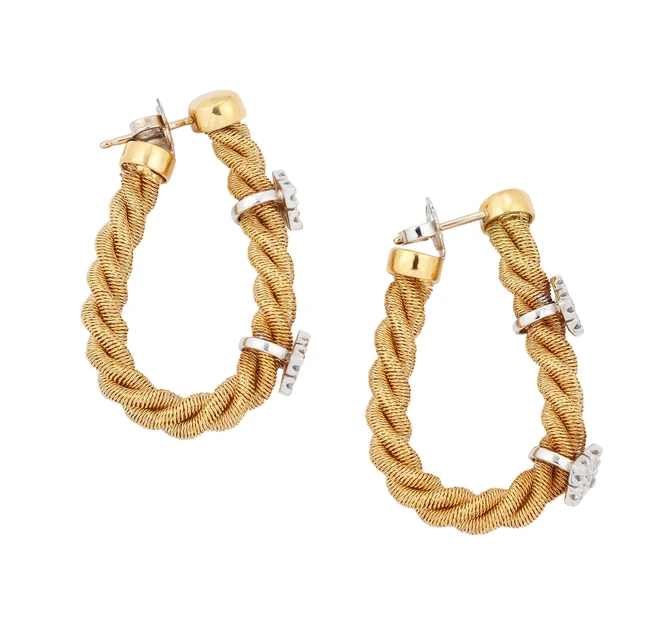 A pair of flexible hoop earrings, designed as three rows of twisted, wrapped wire, with...
