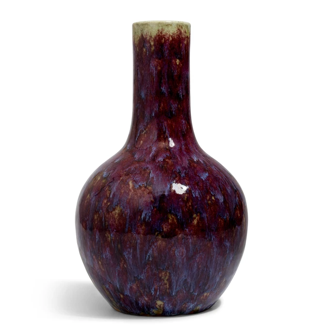 A Chinese flambé vase, late Qing/Republic period, with reddish-purple glaze suffused with...