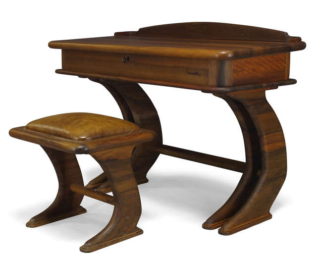 
	
		Marc Van Rampelberg (b.1949), an Iroko writing desk and stool  
		c.1986, with inlaid...
