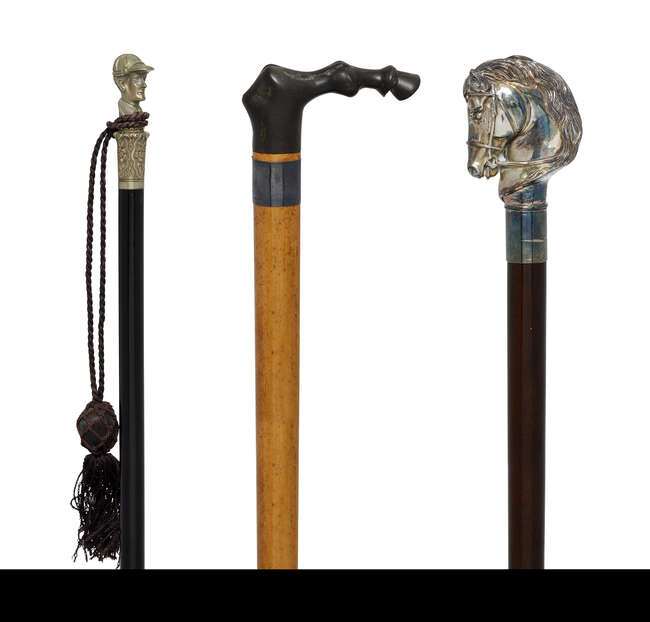 
	
		Three walking canes of horse interest, early 20th century, comprising: a sterling silver...