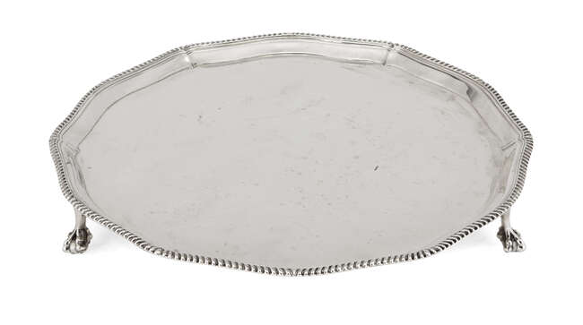 
	
		A shaped silver salver with gadroon rim, Sheffield, c.1946, Roberts & Belk, raised on...