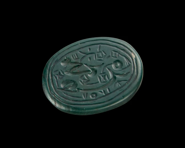 A green hardstone seal, Possibly Iran, 
 