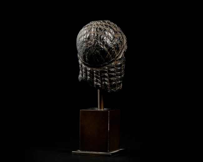 An Egyptian basalt head of a queen or goddessHellenistic, Ptolemaic dynasty, circa 300 - 30...