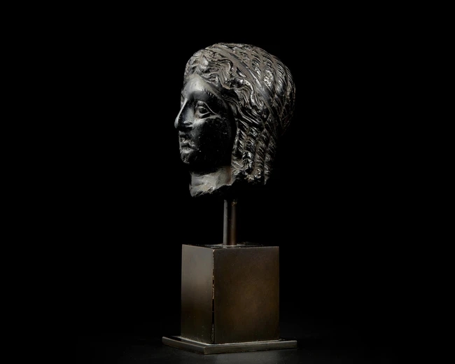 An Egyptian basalt head of a queen or goddessHellenistic, Ptolemaic dynasty, circa 300 - 30...