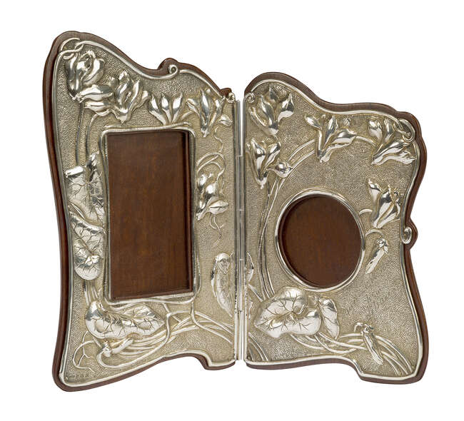 
	
		An Art Nouveau &#39;Japanesque&#39; silver and mahogany hinged double photograph frame 
		Mark...