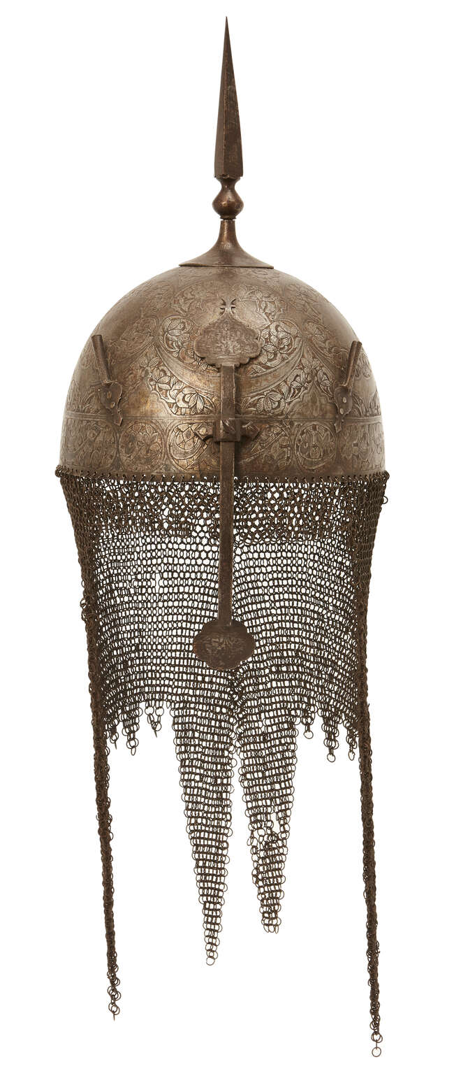 
	
		A Qajar gold damascened steel helmet and shield,
		Persia, 19th century, the helmet of...