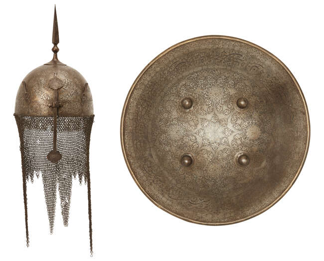
	
		A Qajar gold damascened steel helmet and shield,
		Persia, 19th century, the helmet of...