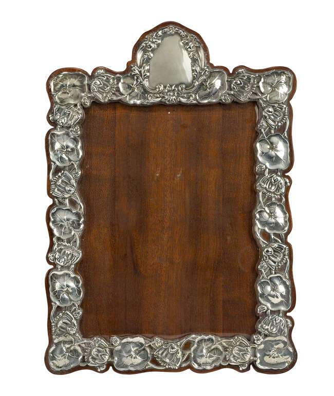 
	
		An Art Nouveau Silver and mahogany photograph frame
		Mark of William Deakin, ...
