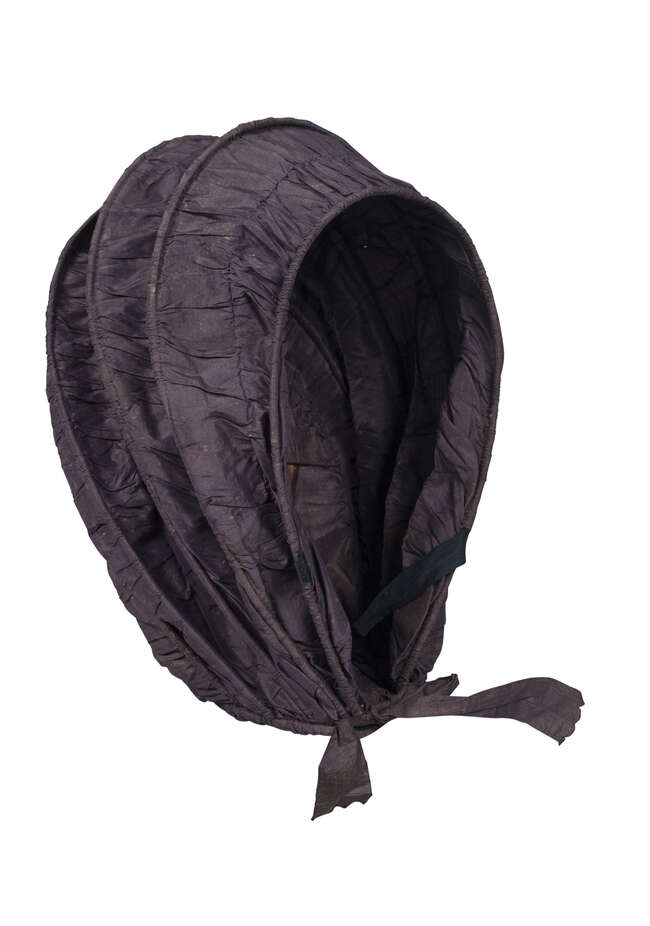 
	
		A late Georgian silk folding ugly (calash/bonnet), circa 1820, of typical form, with...