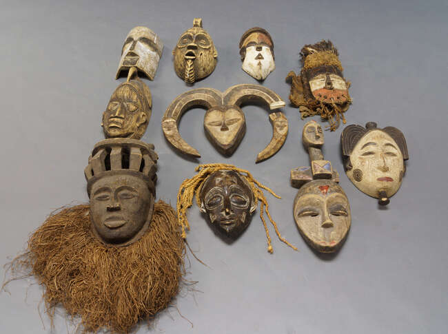 
	
		A tribal mask, in the style of Kwele, Congo, with two horns and additional carving of...