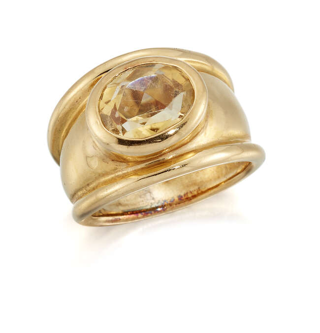 
	
		A citrine single stone ring, the oval citrine collet to a broad tapering hoop, ring size...