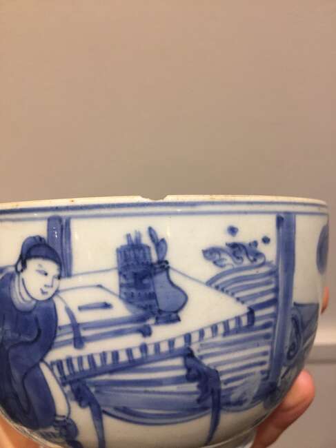 
	
		A Chinese porcelain bowl, Wanli period, painted in underglaze blue with a scholar seated...