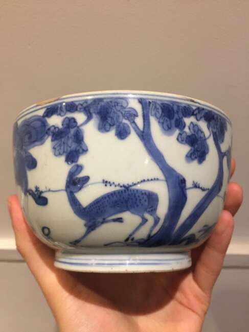 
	
		A Chinese porcelain bowl, Wanli period, painted in underglaze blue with a scholar seated...