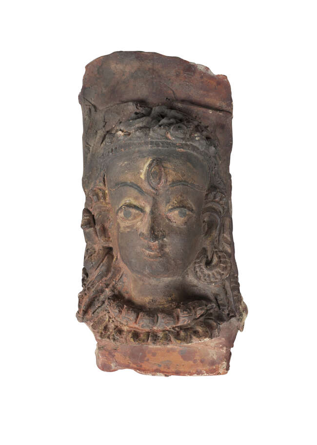 
	
		A Tibetan painted terracotta head of Shiva, 19th century, with later painted features,...