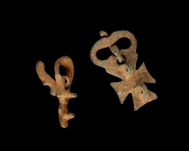 Two Byzantine bronze buckles,circa 5th-6th Century A.D.
one with a cross, 3.8cm, the other...