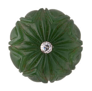 
	
		A carved jade button with central diamond, India, 19th century, of round form carved in...