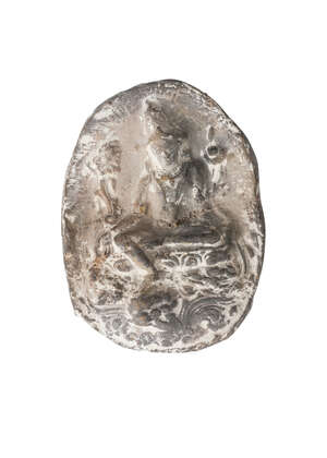 
	
		A Tibetan terracotta votive plaque, 18th/19th century, decorated with Tara, seated on a...