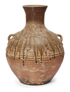 
	
		A Chinese 'proto-porcelain' ash-glazed jar, hu, Han dynasty, moulded to the shoulder with...