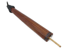 
	
		A Japanese parasol, Meiji period, of paper and bamboo construction with lacquer finish...