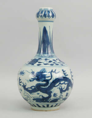 
	
		A Chinese blue and white bottle vase, late 19th/ 20th century, decorated with long...