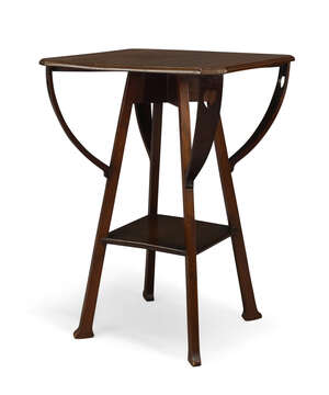 
	
		An Arts and crafts mahogany two-tiered occasional table 
		c.1905 
		The almost square...