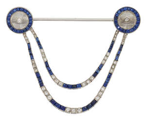 
	
		An Art Deco rock crystal, sapphire and diamond jabot pin, each terminal composed of a...