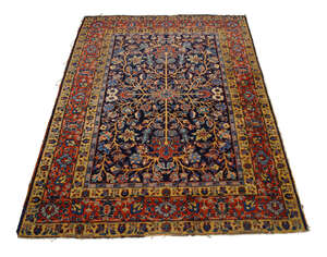 
	
		A Khamseh rug, South Persia, with radiating stylised foliate design on blue ground with...