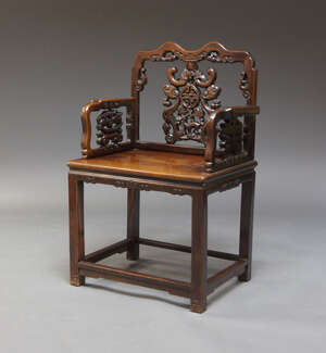 
	
		A Chinese hardwood armchair, 20th Century, the carved and pierced back and armrests,...