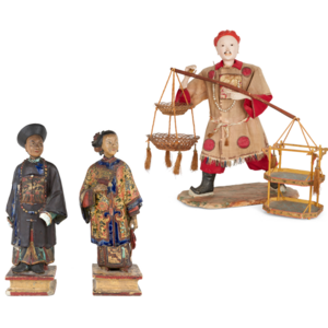 
	
		A pair of Chinese polychrome pottery figures of officials, mid-19th century, depicting a...