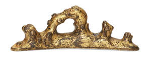 
	
		A Chinese gilt bronze brush rest, 18th century, cast as a dragon's head emerging from...