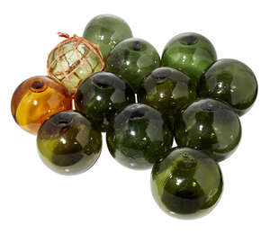 
	
		A group of twelve Japanese glass fisherman's floats, 20th century, including one amber...