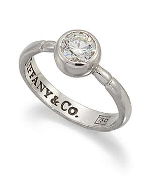 
	
		A diamond single stone ring by Tiffany & Co., the brilliant-cut diamond collet to ridged...