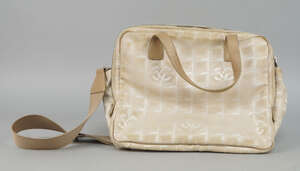 
	
		A Chanel Travel Line cream monogram nylon handbag, with taupe leather handles and canvas...