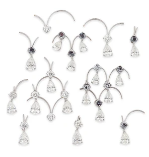 A group of diamond set components, probably from a fringe necklace some set with pear-shaped...