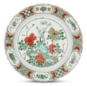 
	
		A large Chinese porcelain charger, Kangxi period, painted in famille verte enamels with...
