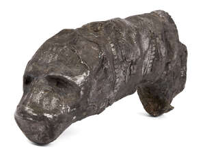A Bactrian silver panther head fragment, 3rd-2nd millenium B.C., with remains of fine repousse and engraved decoration within bands to exterior, hollow to inte