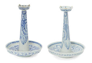 
	
		A pair of Chinese porcelain candlesticks, late 19th century, painted in underglaze blue...