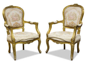 
	
		A pair of Louis XV style giltwood fauteuils, early/mid 20th Century, the curved backrest...