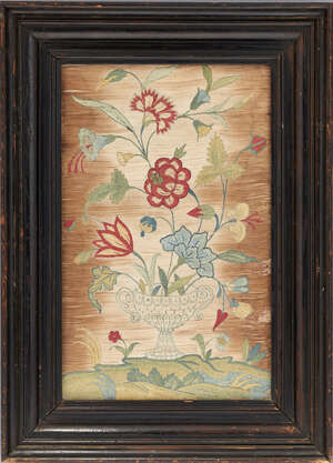 
	
		A pair of English silk needlework pictures of urns, early 18th century, each with...