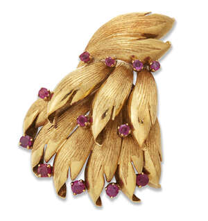 
	
		An Italian, ruby brooch, of  stylised foliate design, each petal with single claw-set...