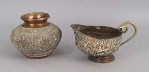 
	
		An Indian spun copper vase, 20th century, decorated with panels of Ganesh and other India...