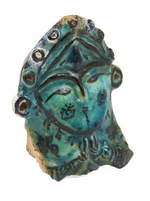 
	
		A Kashan pottery fragment of a figural vessel, Iran, 13th century, painted in black under...