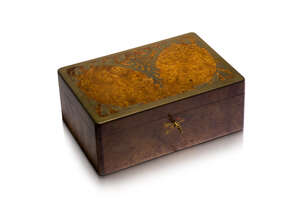 An Art Nouveau brass inlaid burr-walnut jewellery box, probably French 
		c.1900, paper label for 'Aux Galeries Lafayette, Paris' 
		The rectangular 