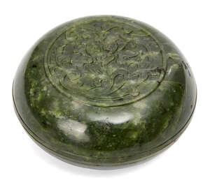 
	
		A Chinese spinach jade circular box and cover, 18th/19th century, carved in low relief to...