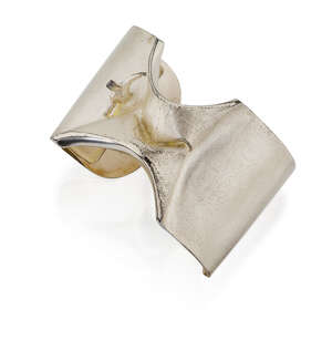 
	
		A 'Man from Mercury' cuff bracelet by Bjorn Weckstrom, featuring a tiny human figure...