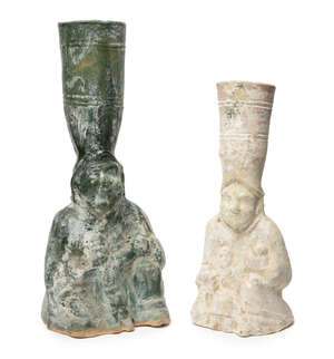
	
		Two Chinese pottery figural candle holders, Han dynasty, each modelled as a seated figure...