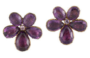 
	
		A pair of Georgian gilt metal foiled purple paste earclips, of flowerhead cluster design,...