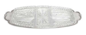 A silver and glass hors d'oeuvres dish, Sheffield. c.1943, Frank Cobb & Co Ltd., of shaped, oblong form, the silver stand with raised edge to five cut glas