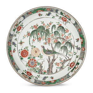 
	
		A large Chinese porcelain dish, Kangxi period, painted in famille verte enamels with a...