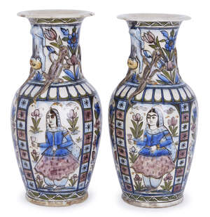 
	
		A pair of large Qajar moulded pottery vases, Iran, late 19th century, of baluster form,...